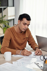 Wall Mural - pensive creative ui designer drawing wireframe for mobile application