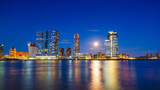 Fototapeta  - Rotterdam, Netherlands. View of the city center. Cove and pier for boats and ships. Panoramic view. Cityscape in the evening. Skyscrapers and buildings.