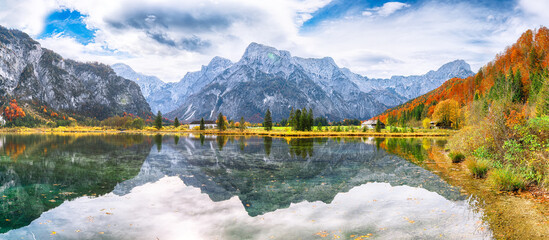 Wall Mural - breathtaking autumn scene of sunny morning on almsee lake. poppular travell destination.