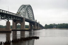Tacony Palmyra Arched Bridge Extending Over The Delaware River On Overcast Day