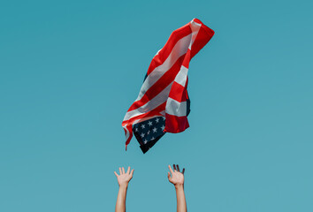 Wall Mural - man propelling an american flag to the sky