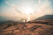 © Alvischui/Wirestock Creators - Rear view of a man standing on the edge of a mountain top overlooking the coast of Hong Kong