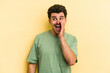 © Asier - Young caucasian man isolated on yellow background shouting excited to front.