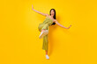 Leinwandbild Motiv Full length photo of overjoyed cheerful vietnamese girl dance have good mood isolated on yellow color background