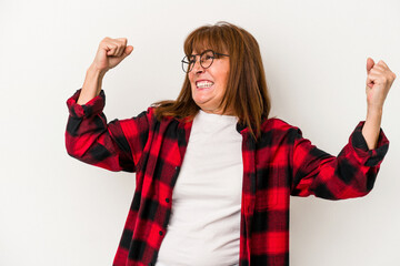 Sticker - Middle age caucasian woman isolated on white background raising fist after a victory, winner concept.