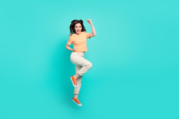 Sticker - Full body photo of overjoyed satisfied lady scream yeah raise fists jump isolated on turquoise color background