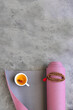 Top view of yoga mat with mala beads and Ayurveda tea for relax yoga practice y meditation. Copy space