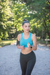 © Milos - A beautiful young girl is jogging in the park. Healthy way of living.