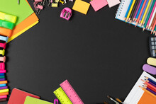 Imagine Of Various Office Supplies, Pins, Rulers, Scissors On And Pencils On Black Background