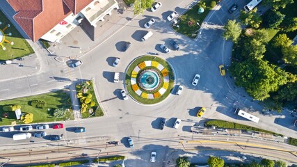  Aerial view of the roundabout at the city center. Tramway, city bus and other vehicles can be seen