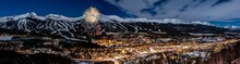 Panoramic View Of New Year's Eve Fireworks Against Snowy Mountains In Breckenridge, Colorado
