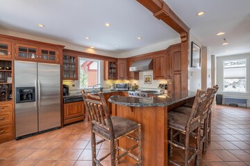 Canvas Print - Modern kitchen interior with an oven, fridge, sink, faucet, wooden cabinet, table, and chairs