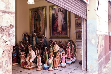 Wall Mural - Corner inside a building with religious sculptures and paintings