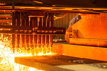 Wall Mural - Close up of an CNC oxygen fuel machine cutting a steel plate