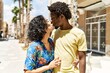 © Krakenimages.com - Young interracial couple kissing and hugging at the city.