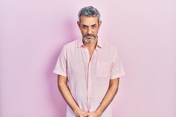 Poster - Handsome middle age man with grey hair wearing casual shirt skeptic and nervous, frowning upset because of problem. negative person.