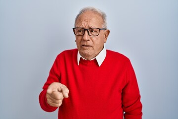 Sticker - Senior man with grey hair standing over isolated background pointing displeased and frustrated to the camera, angry and furious with you