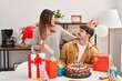 © Krakenimages.com - Mand and woman couple having birthday celebration at home