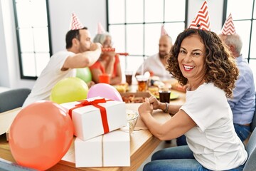 Wall Mural - Group of middle age friends smiling happy celebrate birthday at home.