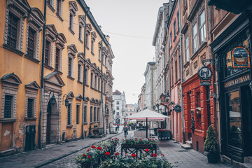 Traditional buildings in a cobblestone street in historical Old town of Lviv.