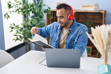 Poster - Young hispanic man sitting on table studying at home