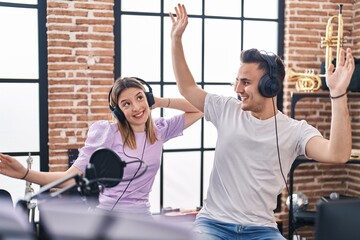 Poster - Man and woman musicians singing song and dancing at music studio