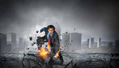 Wall Mural - Determined businessman leaving fire trails on asphalt