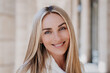 © Iona - Close up portrait of blonde happy entrepreneur with toothy candid smile, Italian young businesswoman happy to be successful, looking at camera. Cheerful caucasian female satisfied by her life.