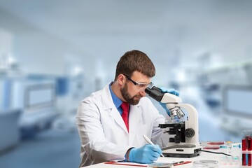 Wall Mural - science research, work and people concept, scientist with microscope working in laboratory