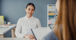 © tirachard - Young Asia businesswomen applicant pass job interview for enterprise company position or during corporate business meeting sitting on office desk at workplace. Hire candidate at job interview concept.