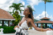 Beautiful young black woman posing outside looking at the camera. Jamaican woman.