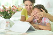 © aletia2011 - happy mother and daughter using tablet together at home. Mother making surprise to her daughter