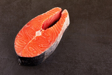 Wall Mural - Salmon steak on black