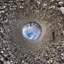 Blue Sphere Little Planet Inside Gravel Road And Pebbles. Curvature Of Space