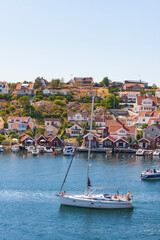 Wall Mural - Sailboat at the old coast village Fiskebackskil on the Swedish west coast