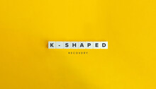 K-shaped Economic Recovery. Text On Block Letter Tiles On Yellow Background. Minimal Aesthetics.