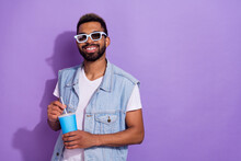 Photo Of Dreamy Funky Man Wear Jeans Waistcoat Dark Glasses Enjoying Beverage Empty Space Isolated Violet Color Background