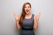Amazed business woman in dress gesture with hands. isolated female business person portrait.