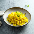 Healthy vegan turmeric rice with fresh parsley