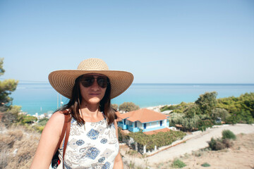 Wall Mural - A young lady at Kathisma beach in Greece