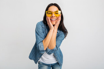 Wall Mural - attractive woman dressed jeans and denim shirt wearing yellow sunglasses