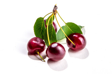 Wall Mural - Fresh ripe raw cherry berry with leaf isolated on white background