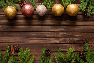 Wall Mural - Christmas background with fir tree and decoration on dark wooden board	