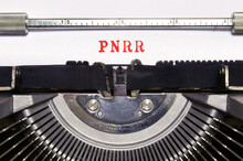 Words 'PNRR' Typed On Vintage Typewriter.The National Recovery And Resilience Plan Is Part Of The Next Generation EU (NGEU) Programme.