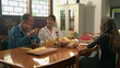 © Marco - Older couple and a teenage daughter eating breakfast in morning table