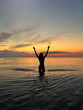 women on orange sunset at sea nature background 