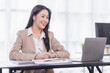 © David - Portrait of Young woman using laptop computer at the office, Student girl working at home. Work or study from home, Asian woman freelance, business, lifestyle concept