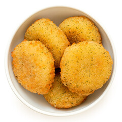 Wall Mural - Fried breaded camembert nuggets with herbs in a white ceramic bowl on white from above.