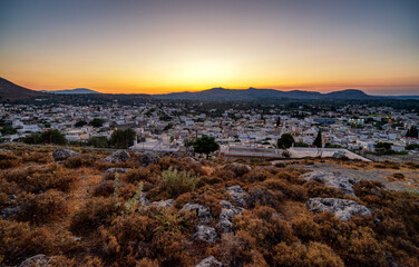 Wall Mural - Colorful sunset over village Archangelos in Rhodes, Greece