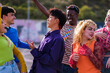 © Ivan - Group of lifestyle teenagers from different cultures dancing together outdoors